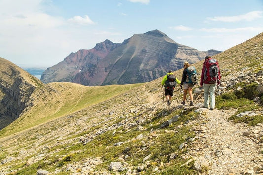 Three people hiking on a mountain