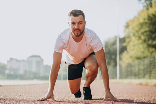 Man athlete jogging at stadium in the morning