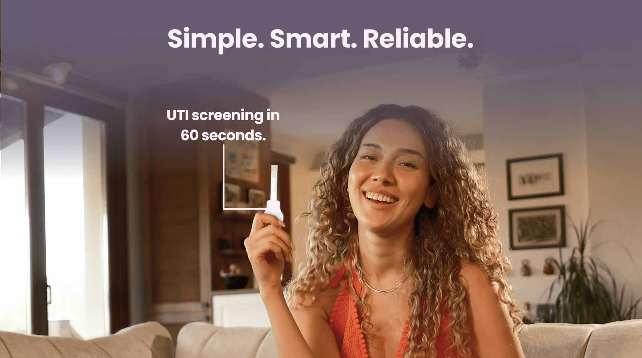 Woman holding a UTI test with text about UTI screening in a home setting