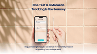 Hand holding a smartphone with Vivoo app and a test strip on a tiled background, with text about testing and tracking.