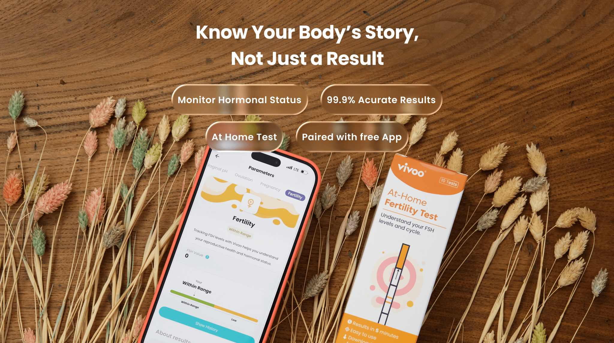 At-home fertility test kit with smartphone app on wooden surface