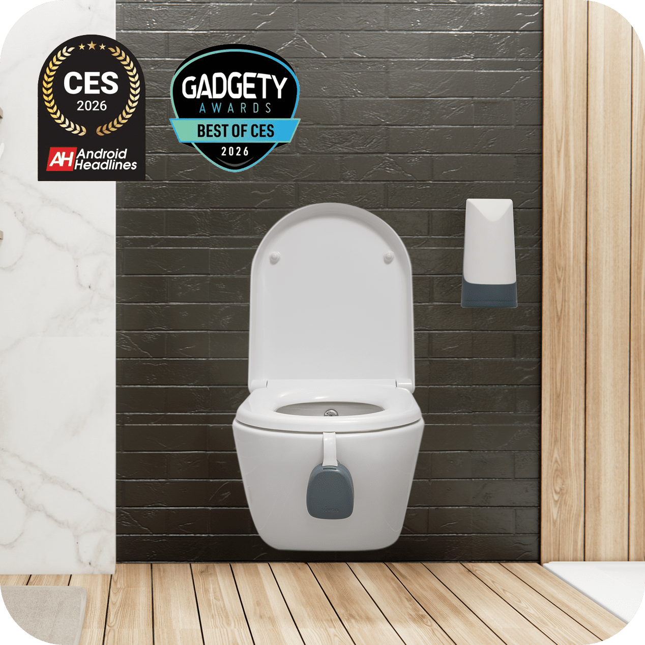 White toilet with additional features against a dark tiled wall, with awards displayed.